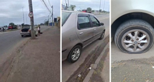 Pneu de carro rasgado aps cair em buraco em Campos