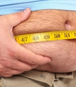 Fat man holding a measuring tape. Weight Loss.